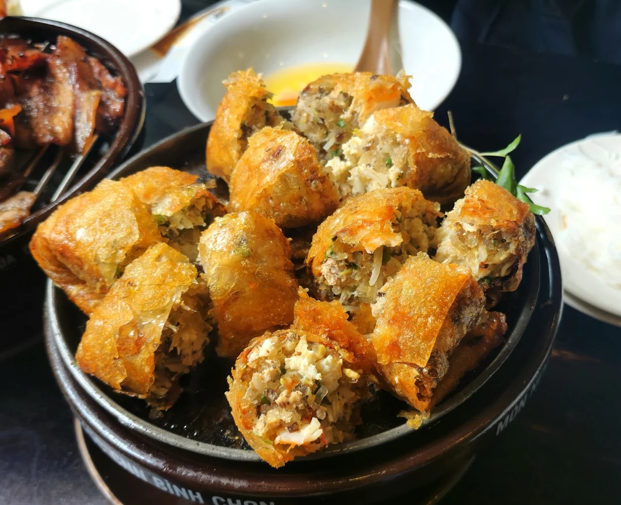 The square crab spring rolls are fried to a crispy golden brown and cut into bite-sized pieces for serving